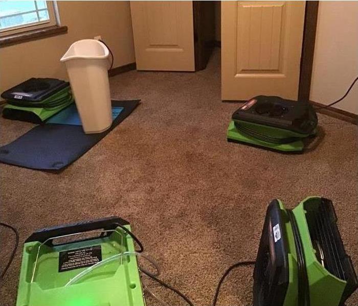 bedroom, wet carpet, green equipment