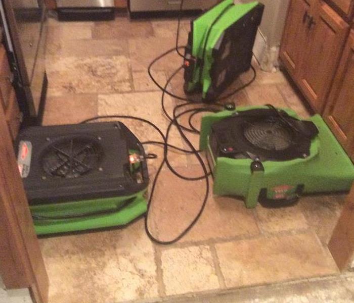 wet kitchen floor, green equipment