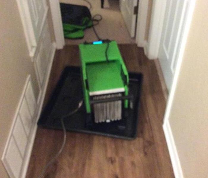 hallway, wet floor, green equipment