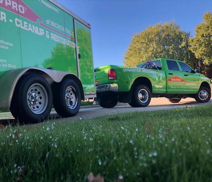 green SERVPRO truck and trailer