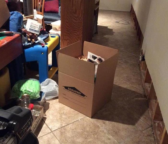 family room, pile of personal belongings, SERVPRO box 