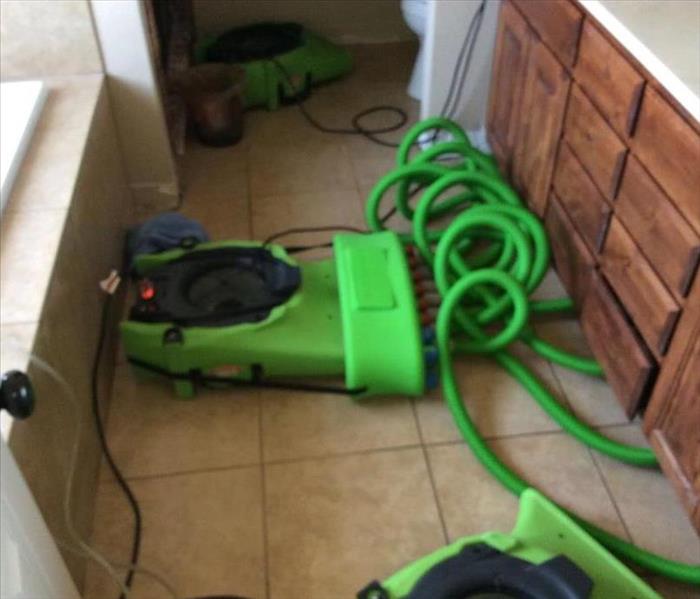 green equipment drying tile floor