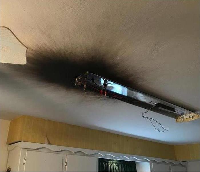 burned kitchen ceiling and light fixture