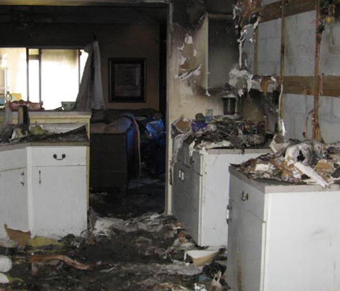 white kitchen blackened by fire