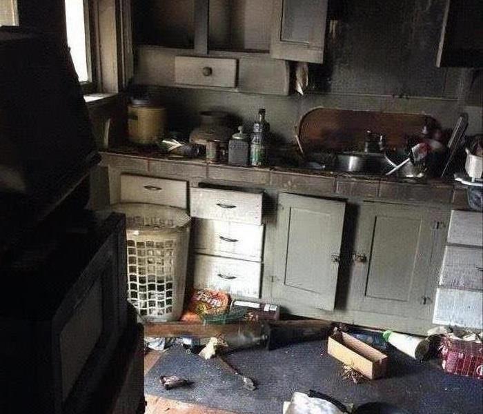 fire damaged kitchen cabinets and debris